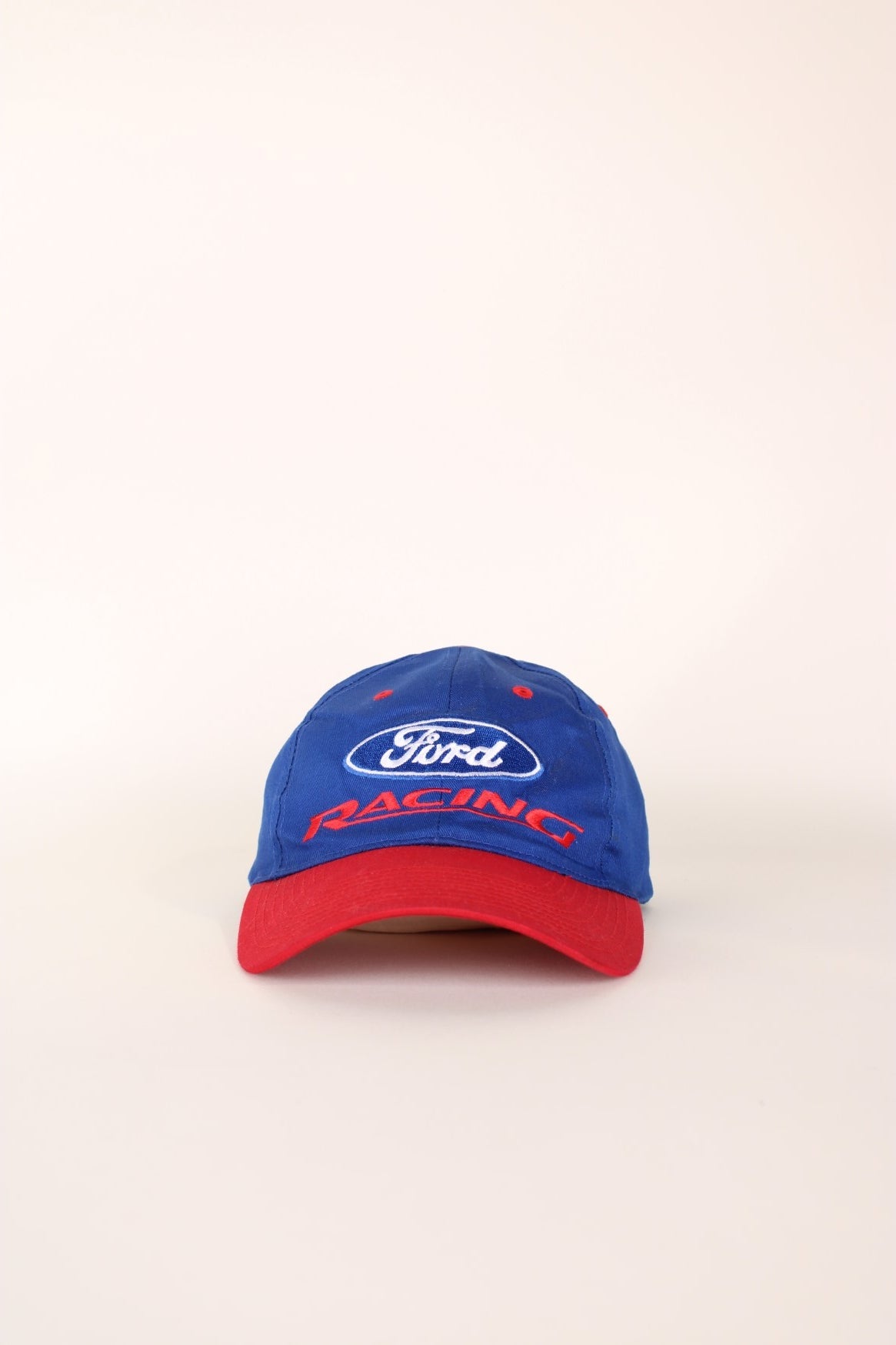 Ford Racing Cap in a blue and red colourway with the spell out logo embroidered on the front, and has a adjustable velcro strap. 