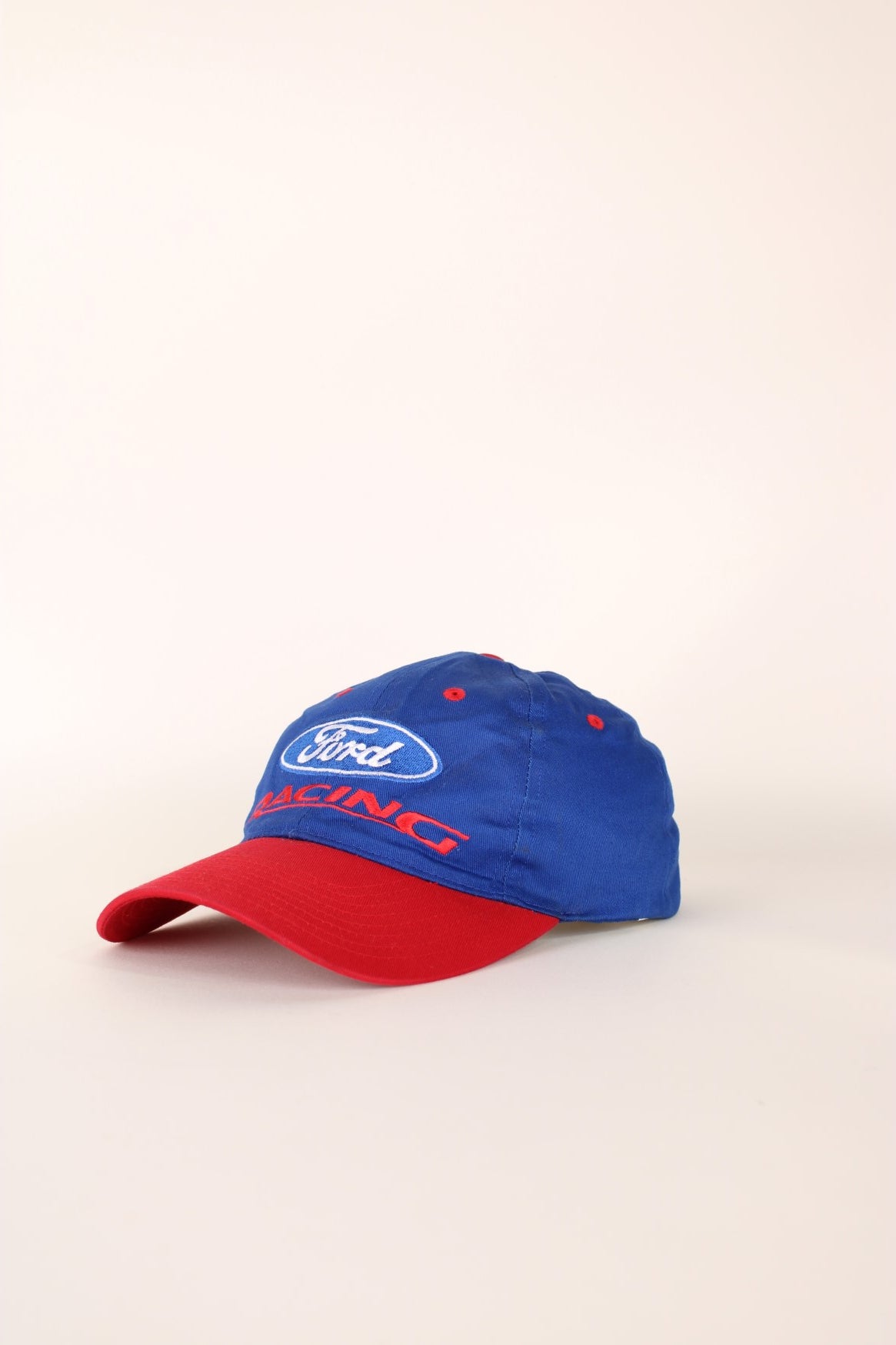 Ford Racing Cap in a blue and red colourway with the spell out logo embroidered on the front, and has a adjustable velcro strap. 