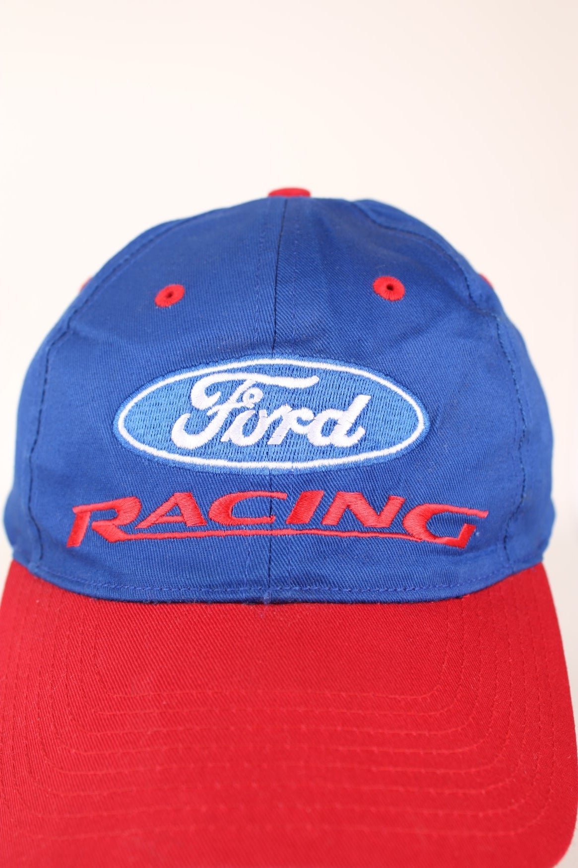 Ford Racing Cap in a blue and red colourway with the spell out logo embroidered on the front, and has a adjustable velcro strap. 