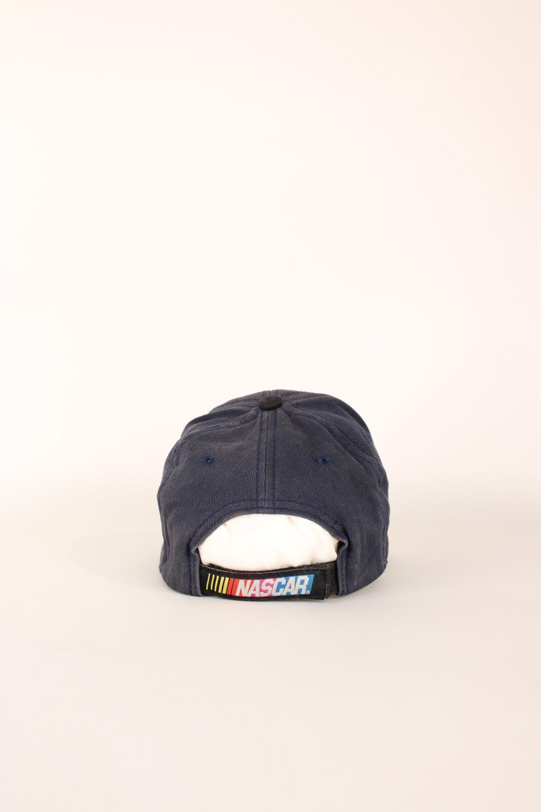 Nascar Racing Cap in a grey colourway with the spell out logo embroidered on the front as well as fire on the front cap, has a adjustable velcro strap.