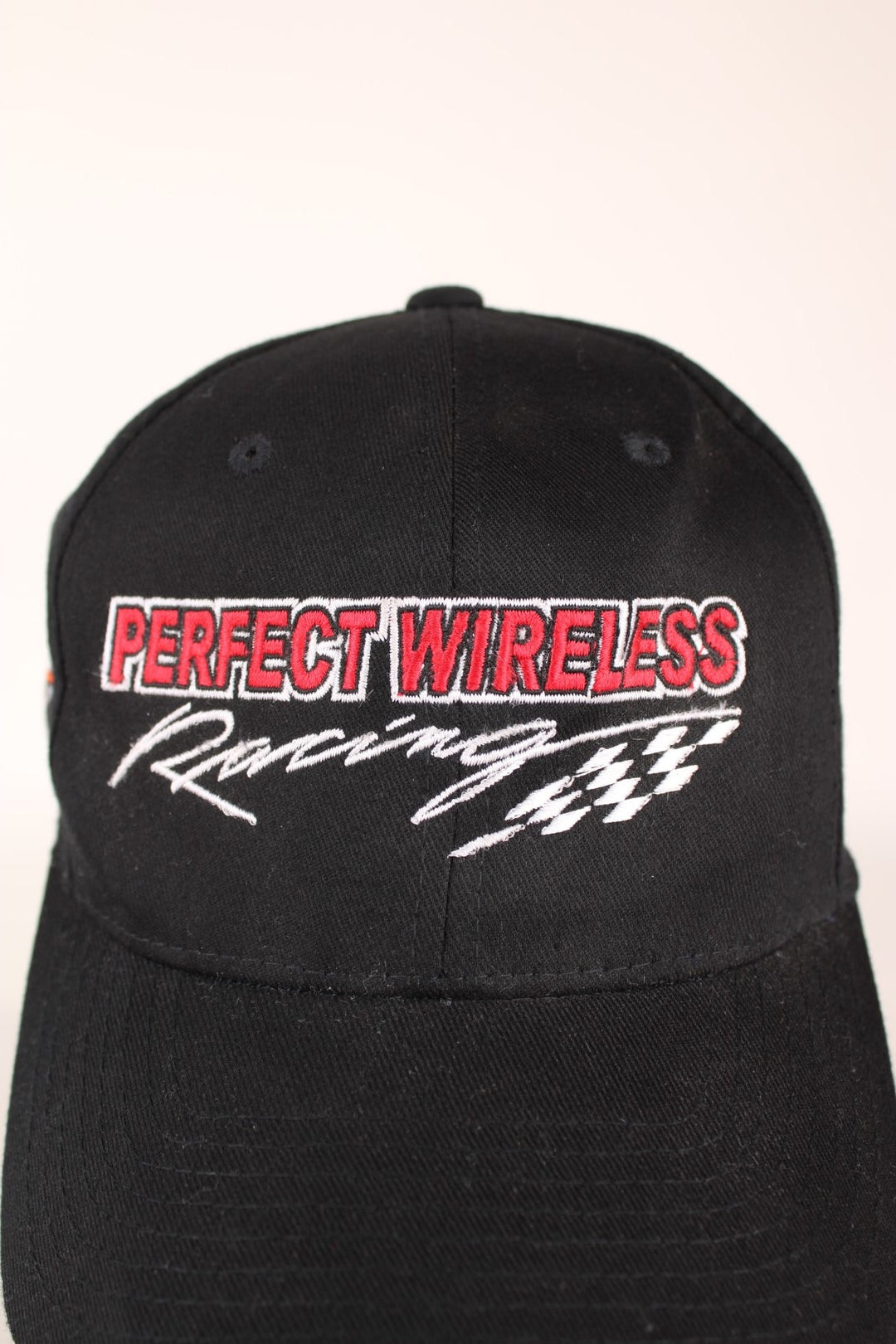 Harley Davidson Racing Cap in a black colourway with 'Perfect Wireless Racing' embroidered on the front and has the Harley logo on the right side.