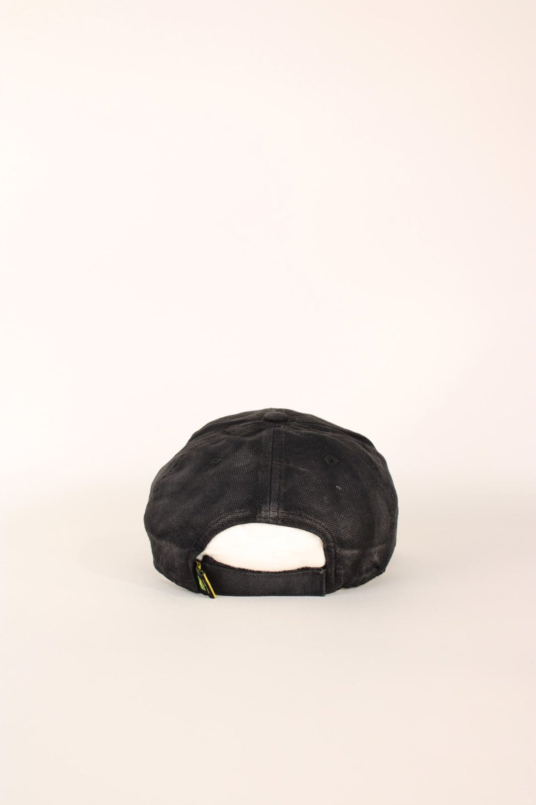 John Deere Cap in a faded black and yellow colourway with the logo embroiderd on the front and has a adjustable velcro strap.