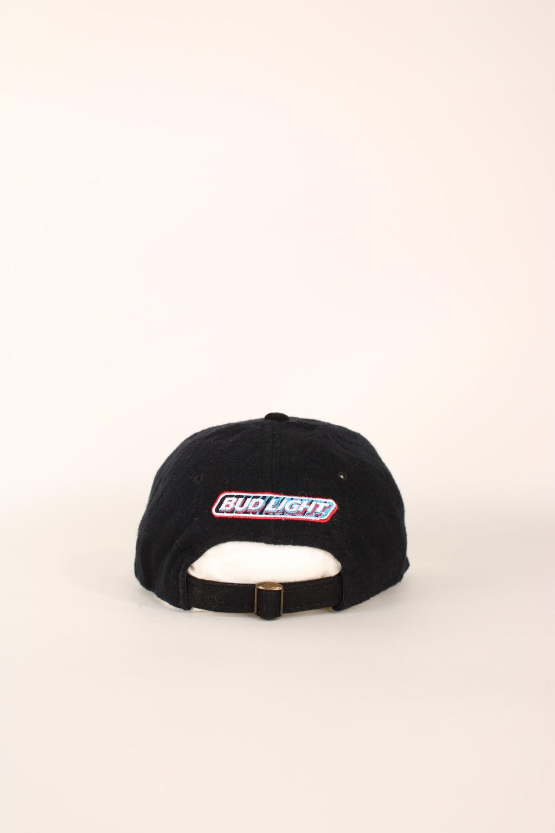 Vintage Professional Bull Riding Year 2000 Cap in a black and brown colourway with the logo embroidered on the front and Bud Light sponsor on the back, has an adjustable strap.