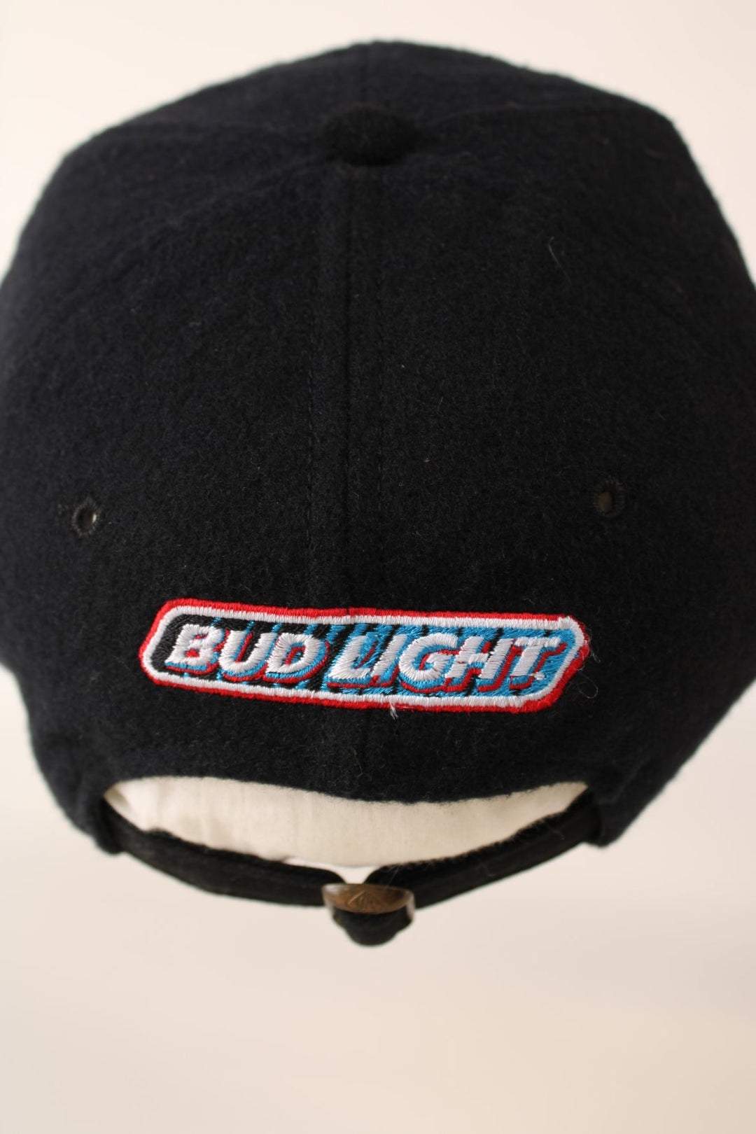 Vintage Professional Bull Riding Year 2000 Cap in a black and brown colourway with the logo embroidered on the front and Bud Light sponsor on the back, has an adjustable strap.