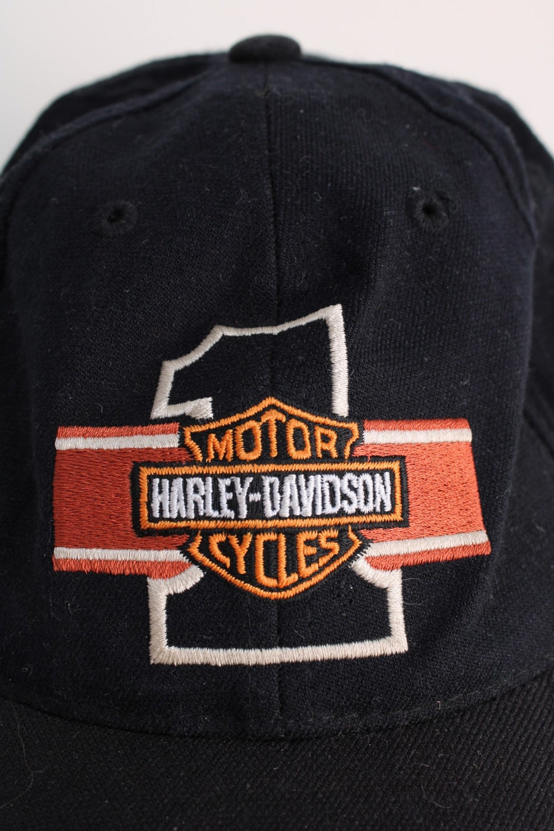 Vintage Harley-Davidson Cap in a black colourway with the logo and graphic embroidered on the front, elasticated hem.