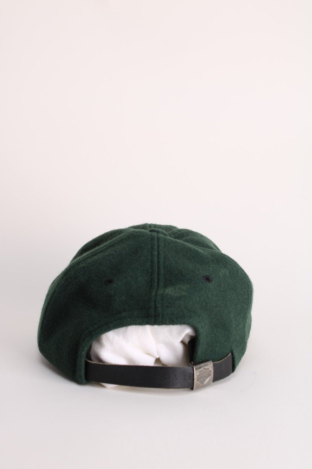 Vintage Harley-Davidson Cap in a green and black colourway with the spell out logo embroidered on the front, and has an adjustable leather strap.