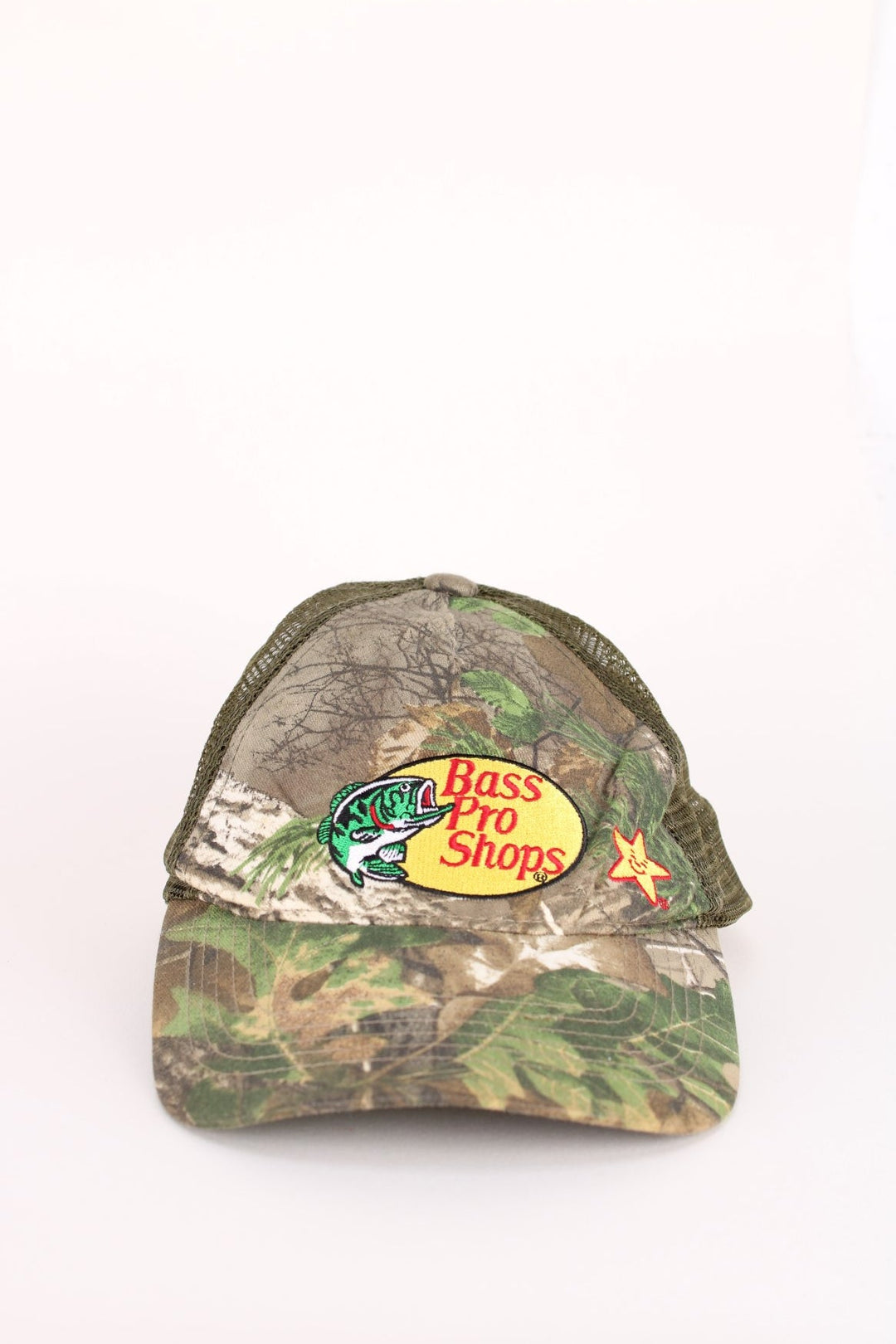 Vintage Bass Pro Shops Camo Cap in a green and brown colourway with the logo embroidered on the front, and has an adjustable snapback.