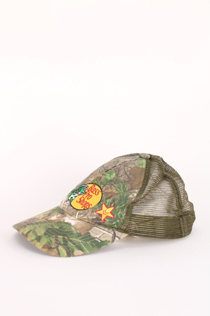 Vintage Bass Pro Shops Camo Cap in a green and brown colourway with the logo embroidered on the front, and has an adjustable snapback.