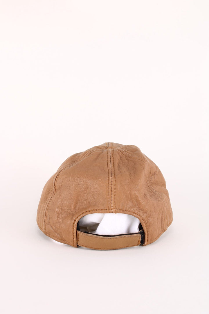 Vintage Toyota Leather Cap in a brown colourway with the logo embroidered on the front, and has an adjustable velcor strap.