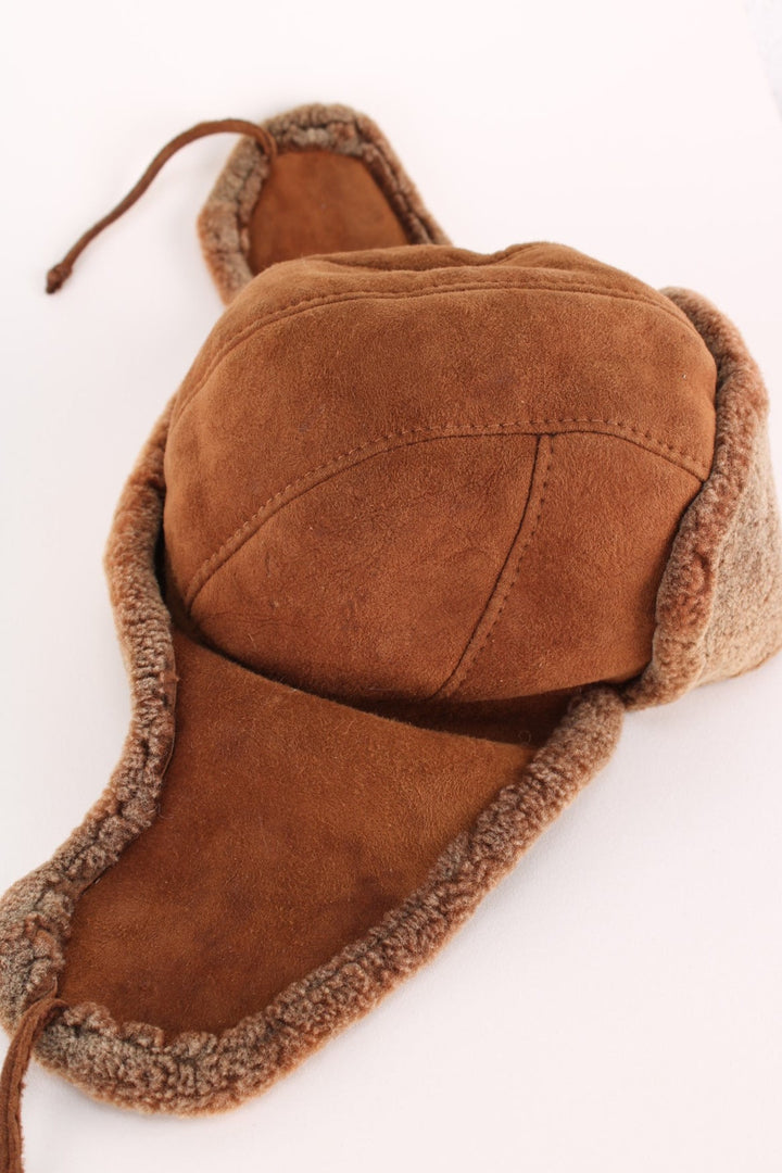 Vintage Trapper Hat in a brown colourway with a fleece lining, and tie up option.