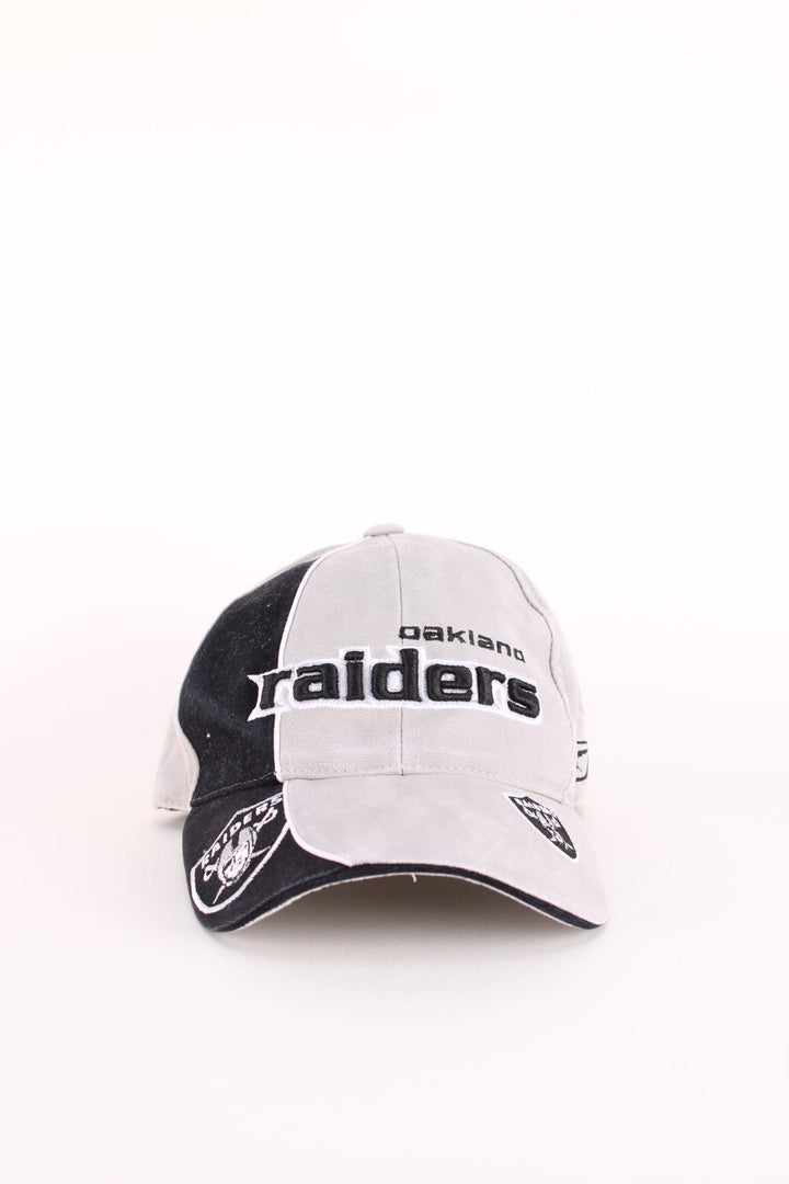 Oakland Raiders NFL Cap in a grey and black colourway with the team logos and spell out embroidered on the hat, and has an adjustable velcro strap.