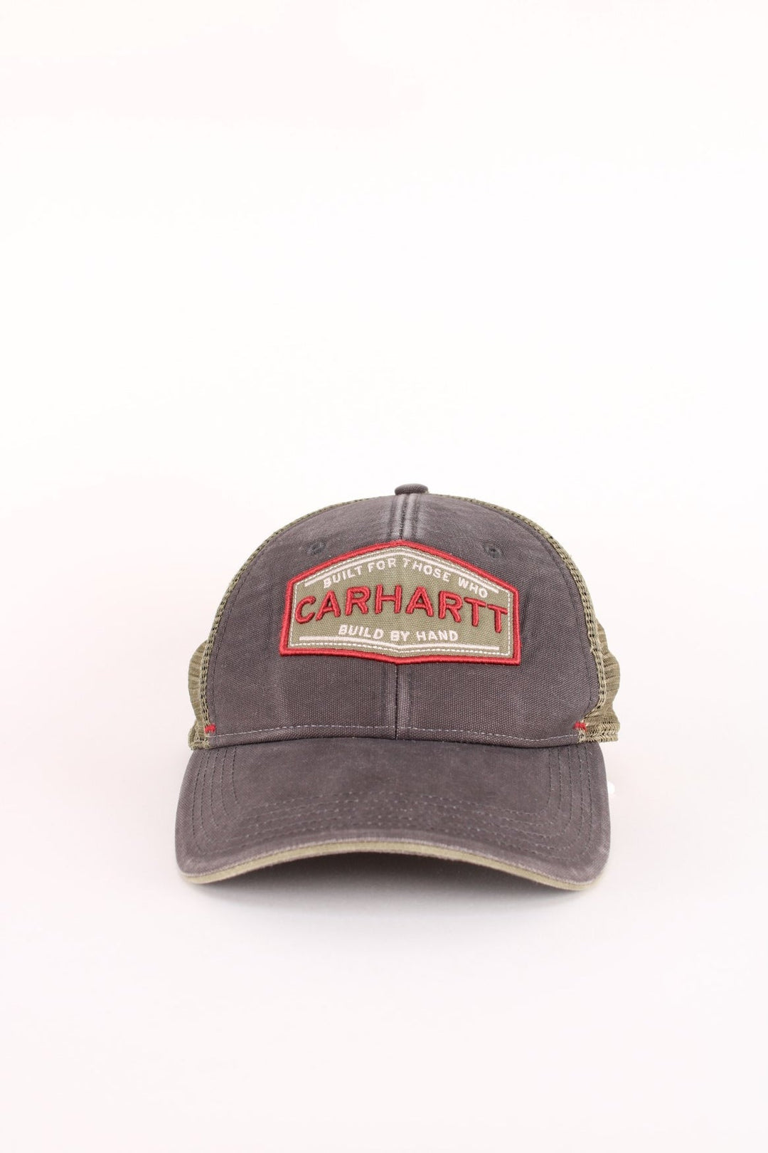 Carhartt Silvermine Trucker Cap in a grey and green colourway with the logo embroidered on the front, and has an adjustable snapback.