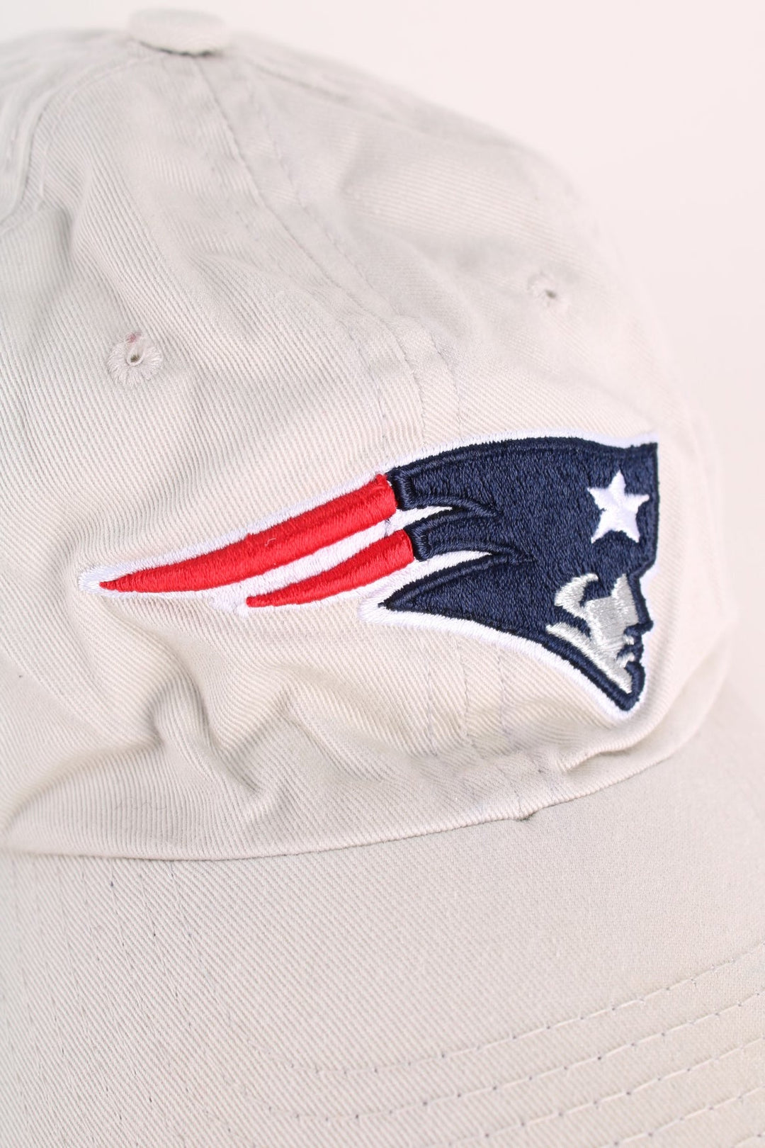 New England Patriots NFL Cap in a grey colourway with the team logo embroidered on the front, and has an adjustable strap.