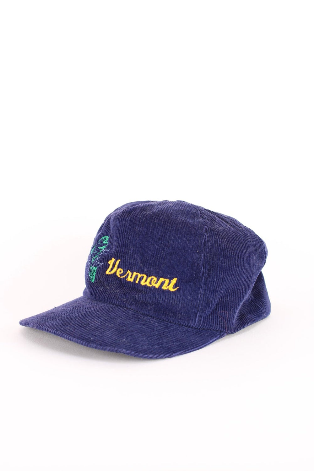 Vintage Vermont Corduroy Trucker Cap in a blue colourway with the logo and fish graphic printed on the front, and has an adjustable snapback.