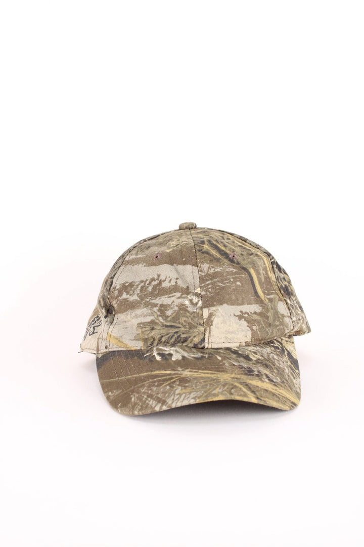 Vintage Real Tree Camo Cap in a green and brown colourway and has an adjustable velcro strap.