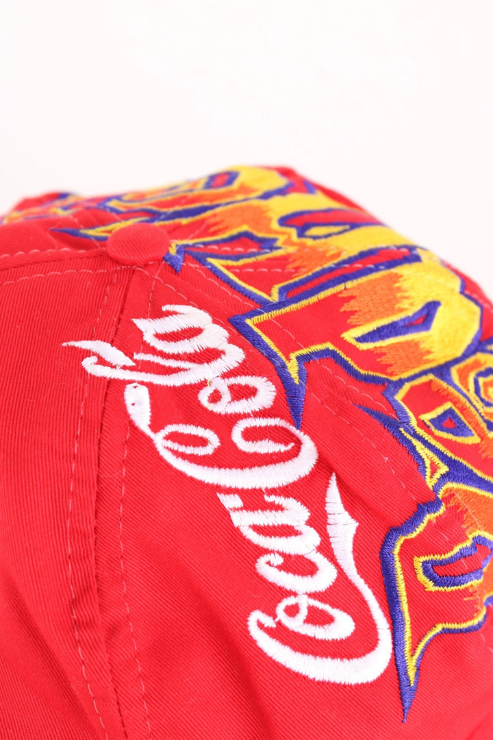 Vintage 90's Coca Cola Red Hot Summer Cap in a red colourway with the spell out and logo embroidered all over, and has a adjustable snapback.