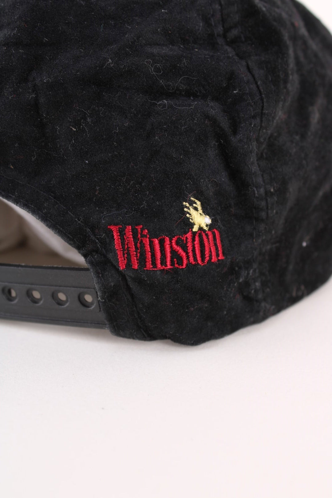 Vintage 80's Winston Racing Team Cap in a black colourway with the spell out logo embroidered on the front, and has a adjustable snapback.