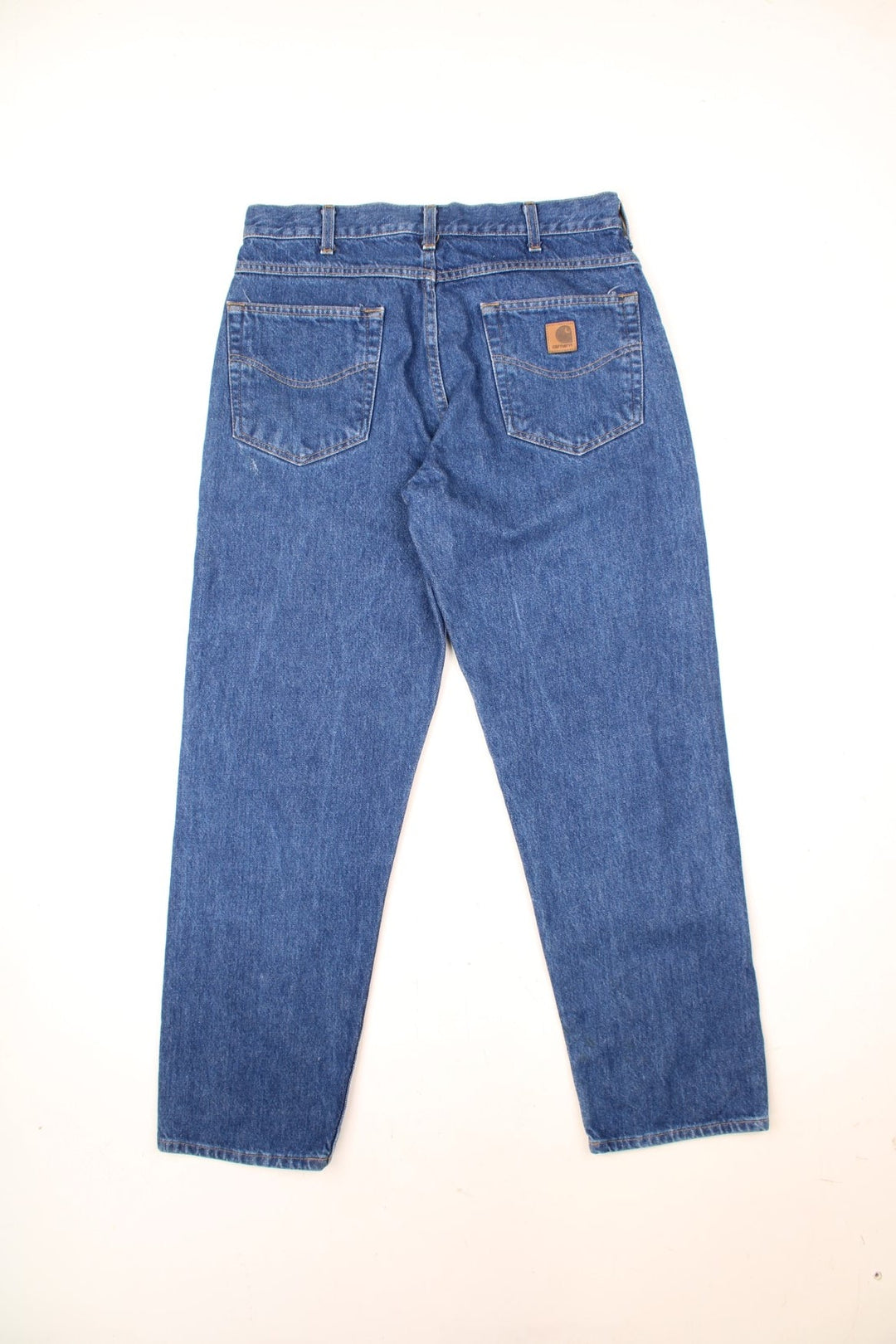 Carhartt Jeans in a blue colourway with the logo embroidered on the back pocket. 