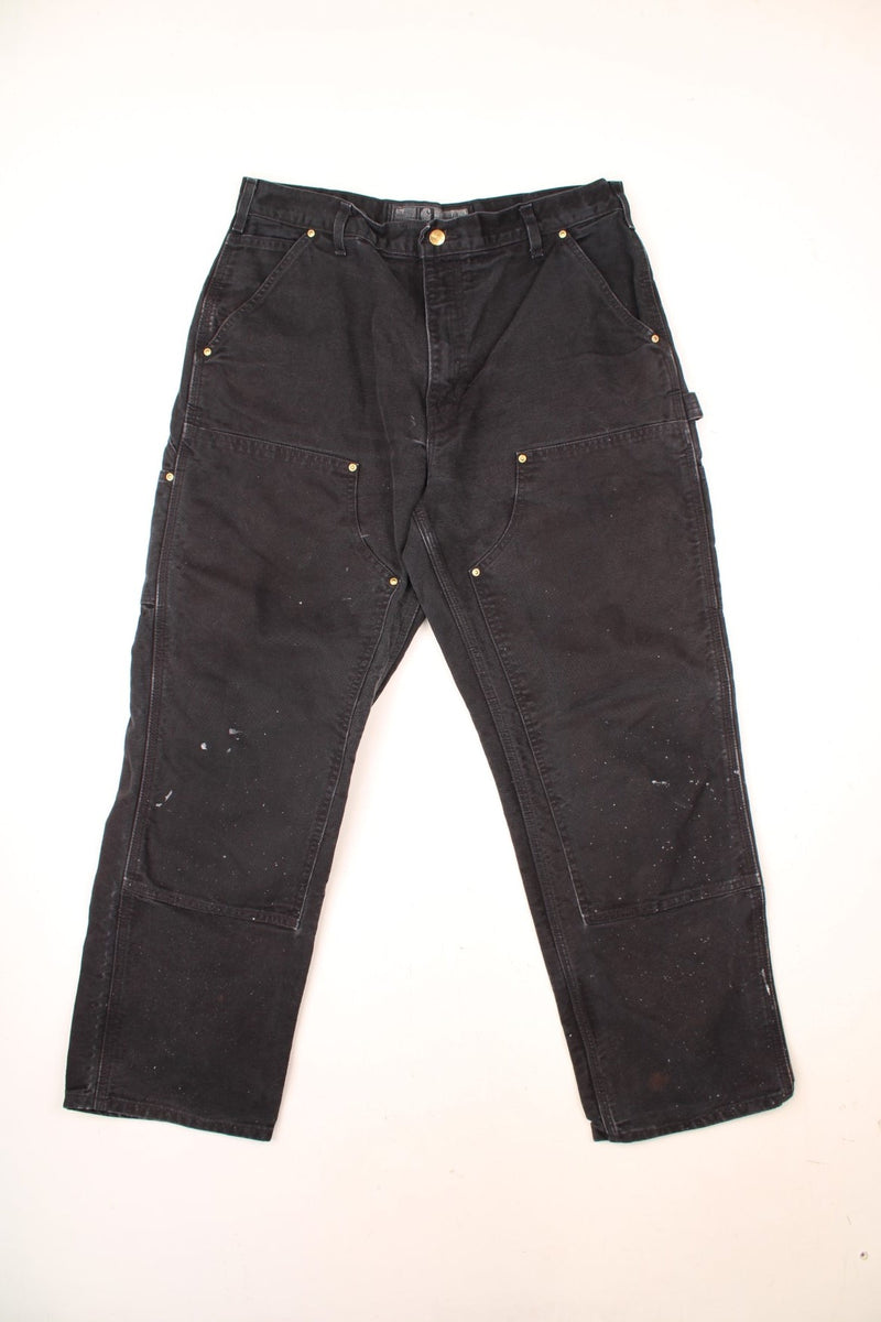 Carhartt Double Knee Jeans in a black colourway with multiple pockets and the logo embroidered on the back.