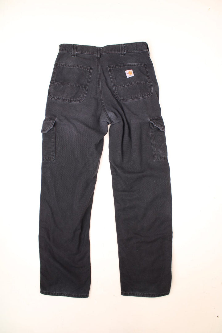 Carhartt Cargo Trousers in a black colourway with multiple pockets and the logo embroidered on the back.