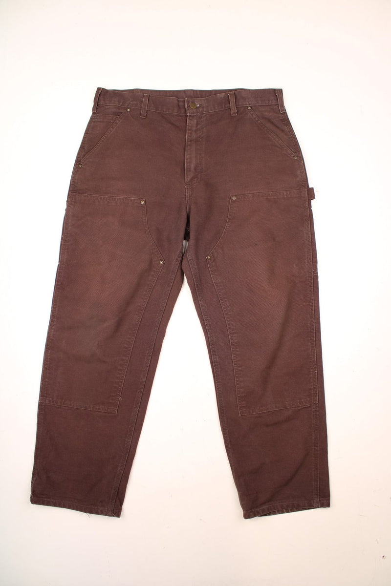 Carhartt Double Knee Jeans in a brown colourway with multiple pockets and the logo embroidered on the back. 