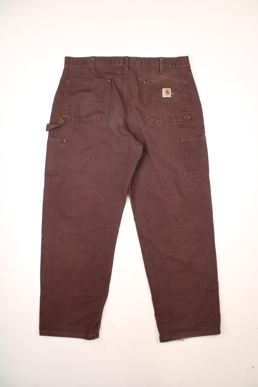 Carhartt Double Knee Jeans in a brown colourway with multiple pockets and the logo embroidered on the back. 