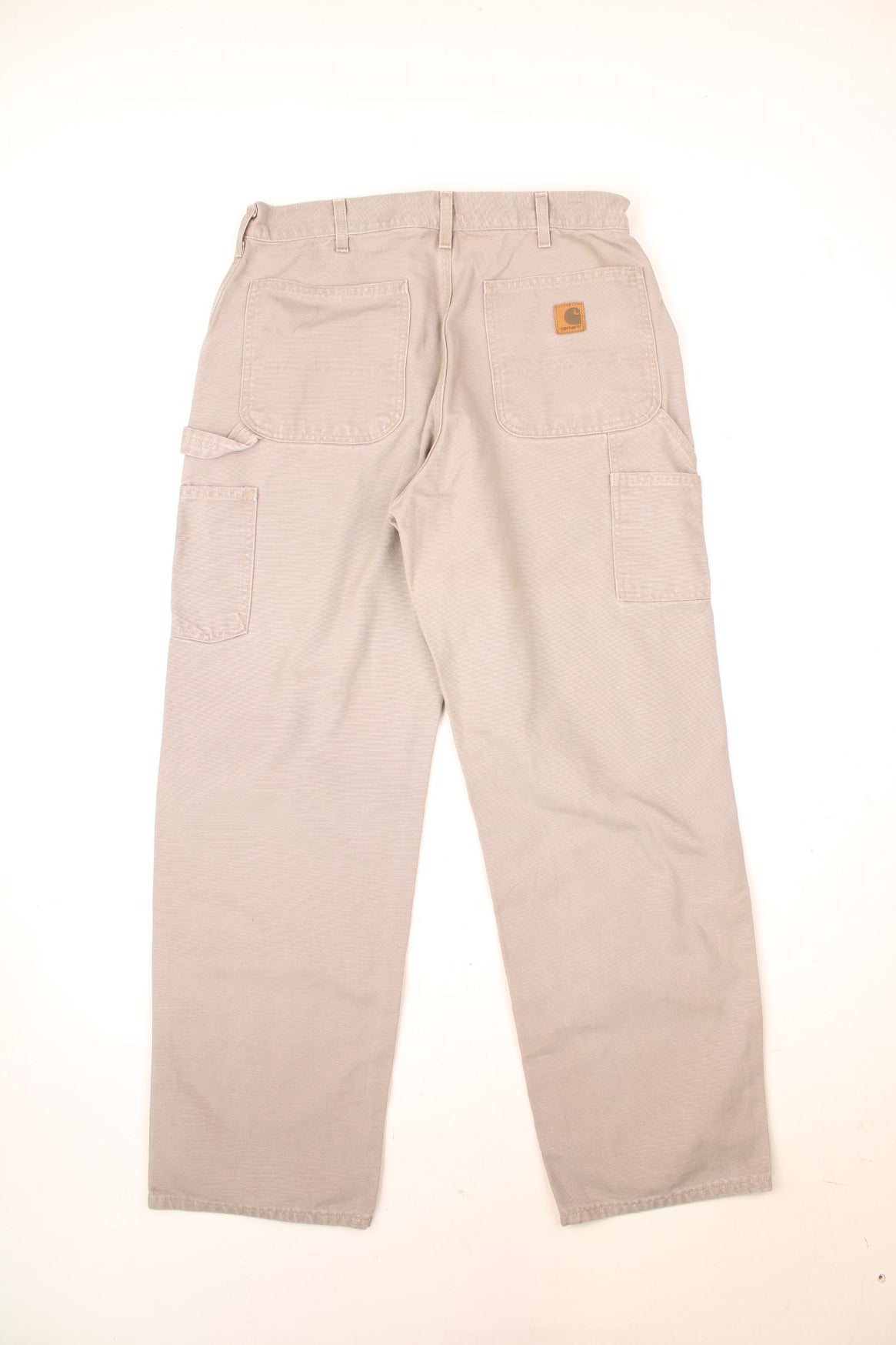 Carhartt Carpenter Jeans in a tanned colourway with multiple pockets and the logo embroidered on the back.