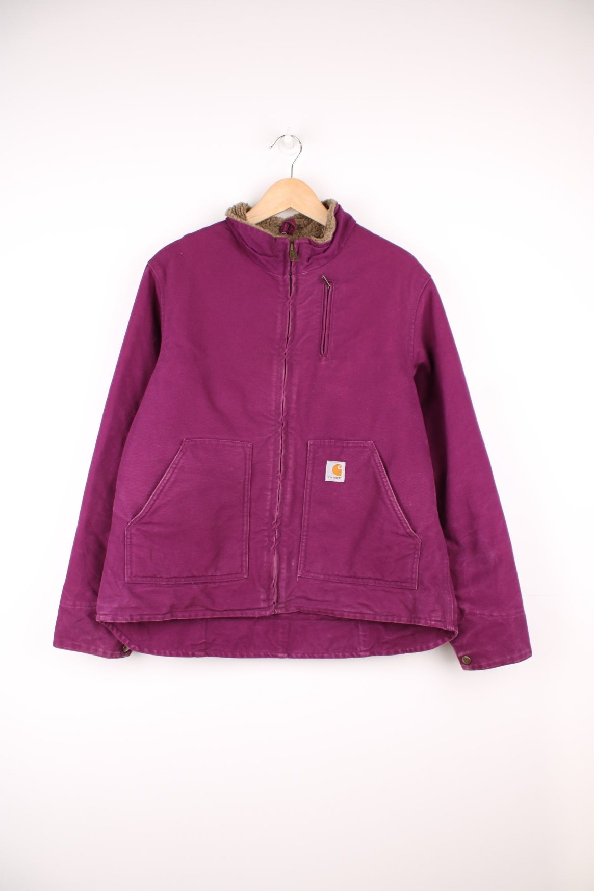 Carhart Detroit Jacket in a purple colourway, zip up with multiple pockets, sherpa lining, and has the logo embroidered on the front. 