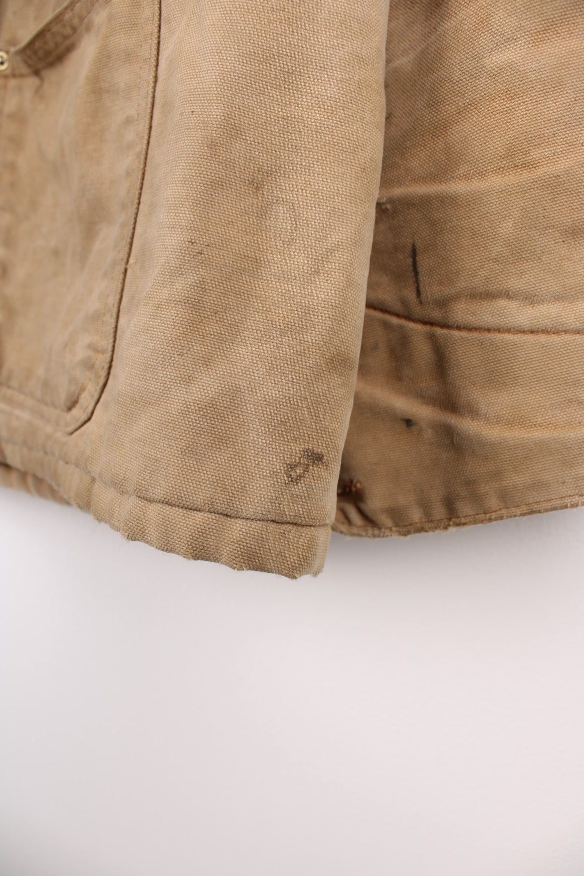 Carhartt Chore Jacket in a tanned colourway with a brown corduroy collar, button up with multiple pockets, blanket lining, and has the logo embroidered on the front. 