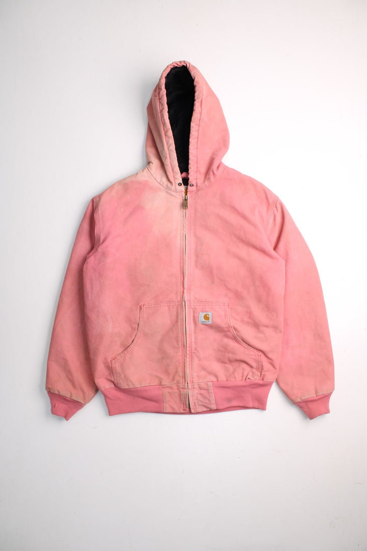 Carhartt Active Jacket in a pink colourway. Zips up and has side pockets, hooded, and has the logos embroidered on the front.