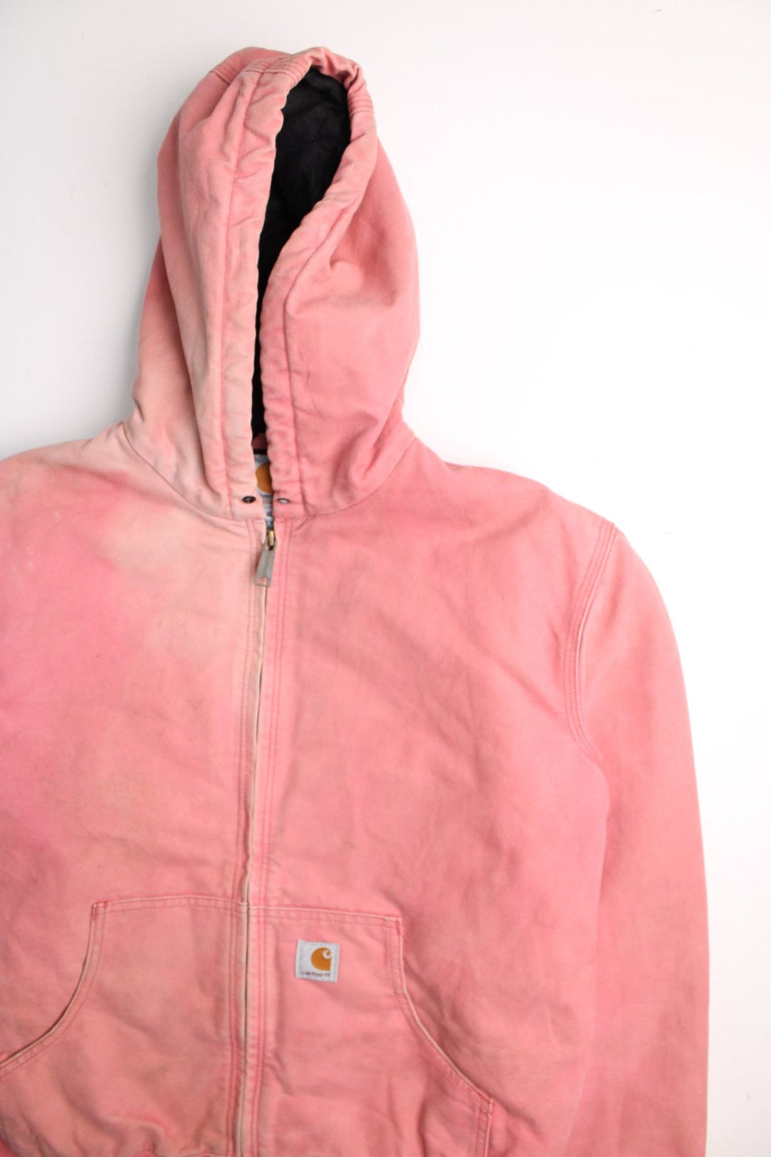 Carhartt Active Jacket in a pink colourway. Zips up and has side pockets, hooded, and has the logos embroidered on the front.