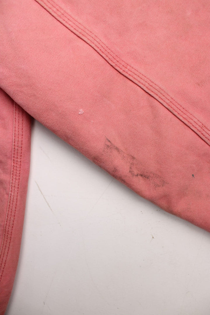 Carhartt Active Jacket in a pink colourway. Zips up and has side pockets, hooded, and has the logos embroidered on the front.