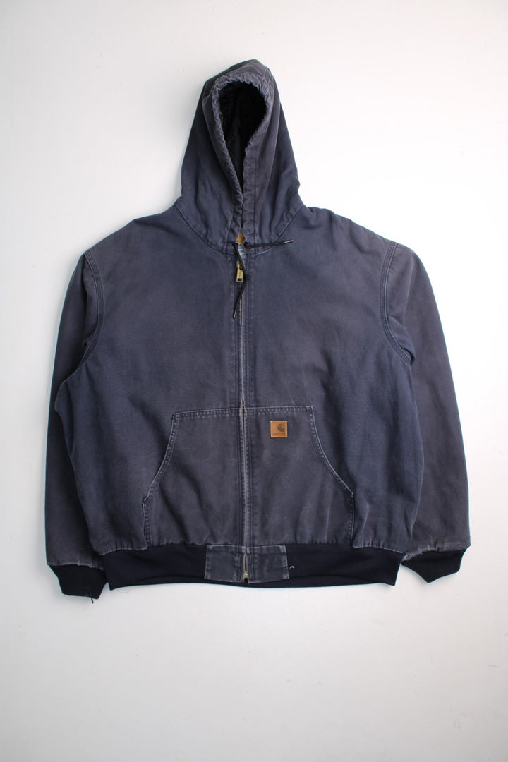 Carhartt Active Jacket in a blue colourway. Zips up and has side pockets, hooded, and has the logo embroidered on the front.