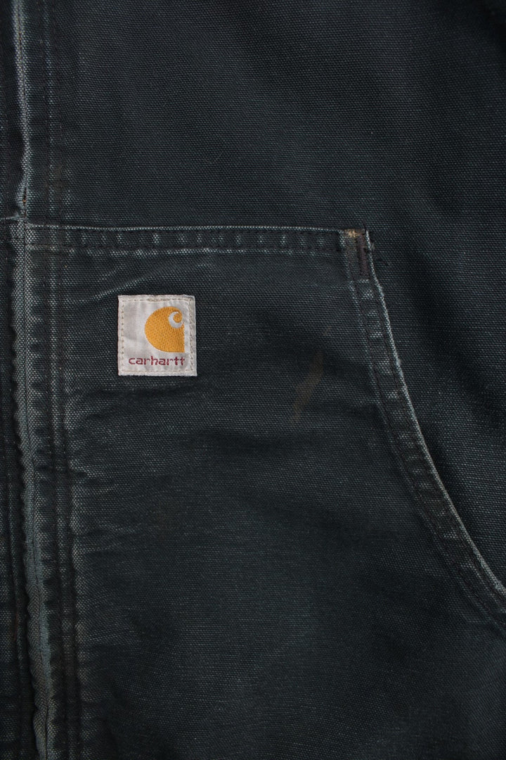 Carhartt Active Jacket in a black colourway. Zips up and has side pockets, hooded, has 'Nummi' business spell out logo embroidered on the front and Carhartt logo embroidered on the pocket.