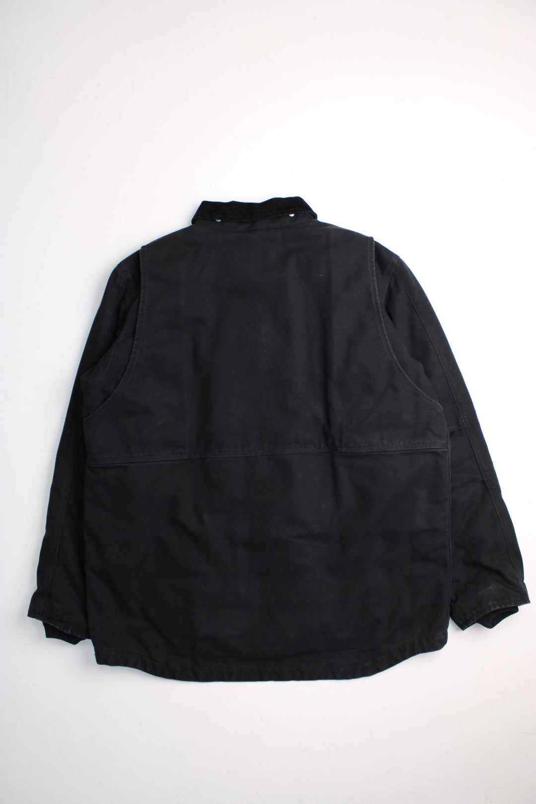 Carhartt Arctic Jacket in a black colourway. Zip and button up with multiple pockets, corduroy collar, and has the logo embroidered on the front.