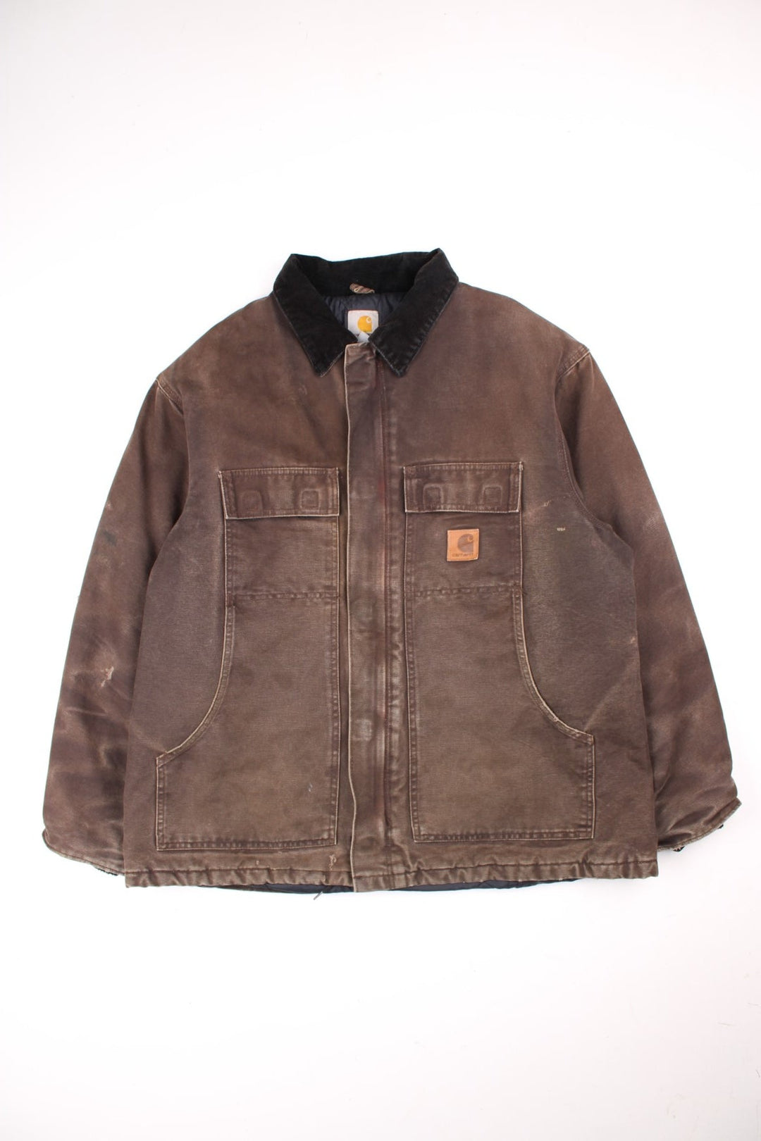 Carhartt Arctic Jacket in a brown colourway. Zips up and has multiple pockets, insulated with a quilted lining, corduroy collar, and has the logo embroidered on the front.