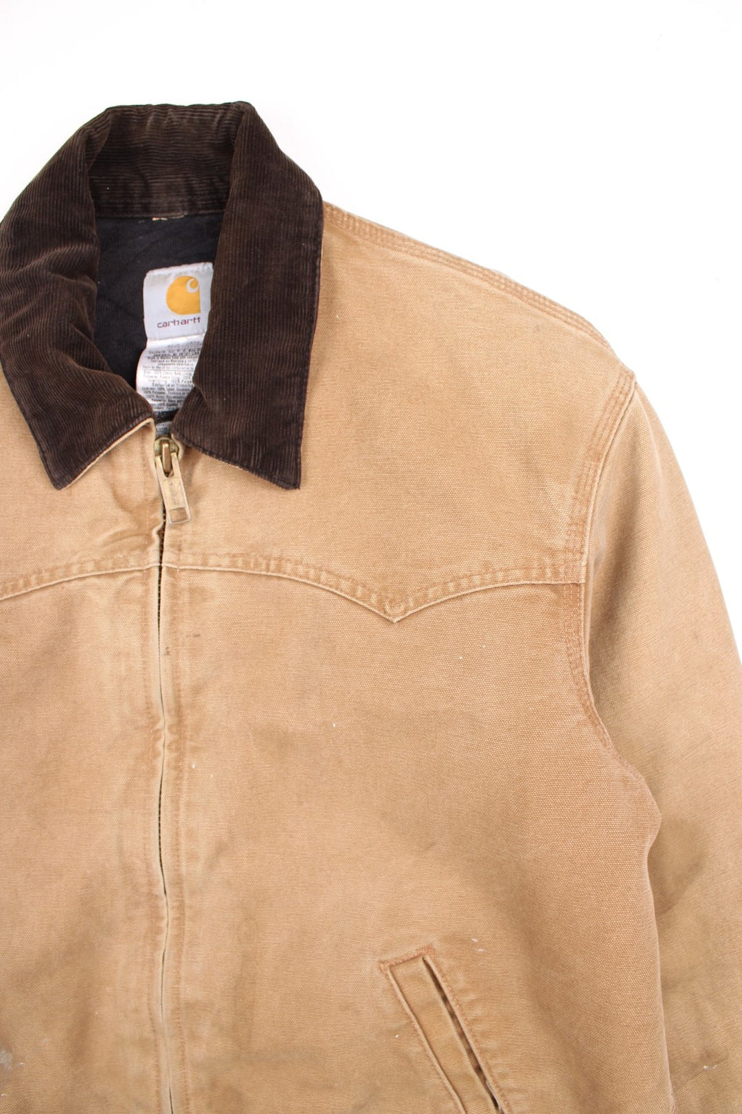 Carhartt Santa Fe Jacket in a tan colourway with a brown corduroy collar. Zips up and has side pockets, and the logo embroidered on the front.