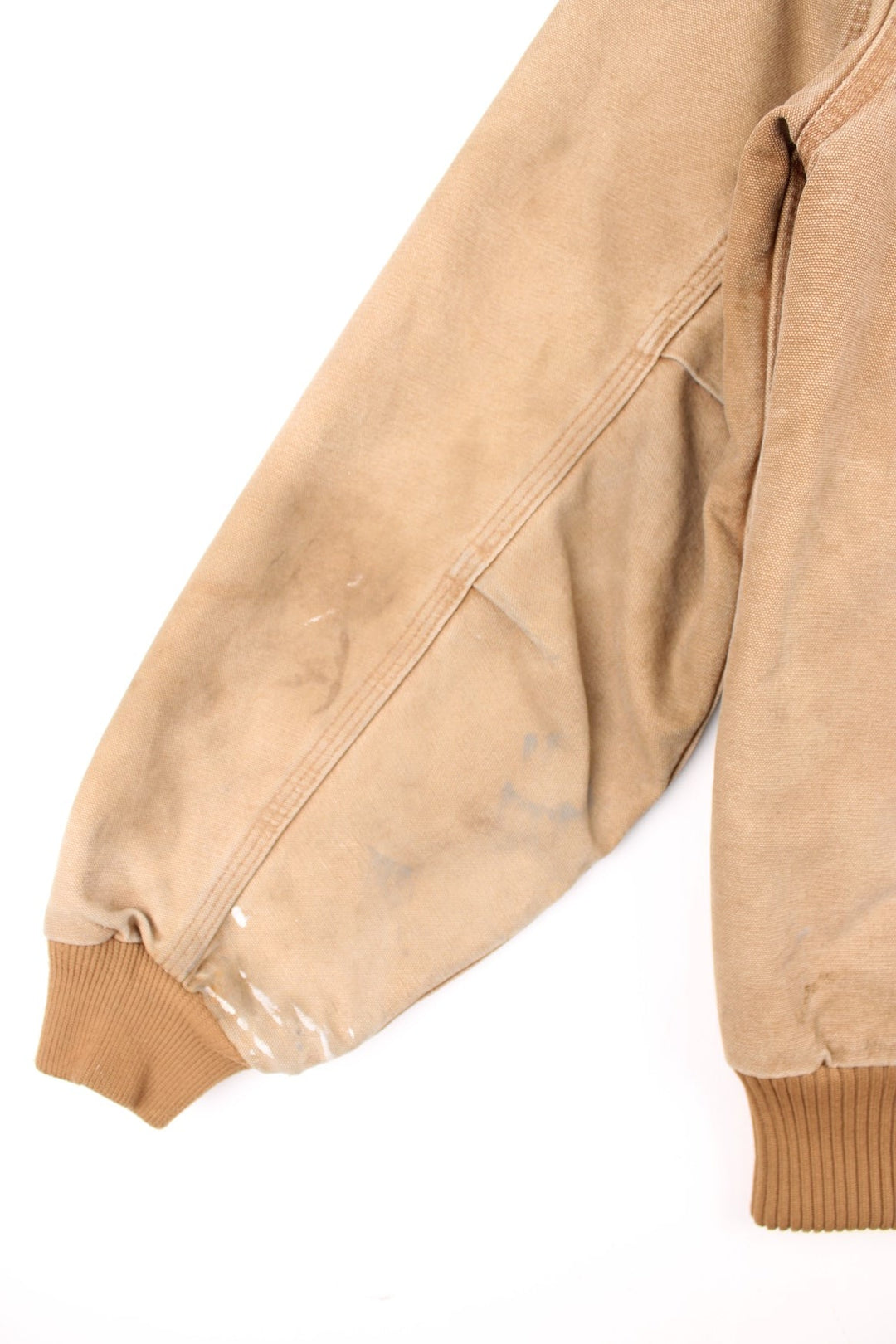 Carhartt Santa Fe Jacket in a tan colourway with a brown corduroy collar. Zips up and has side pockets, and the logo embroidered on the front.