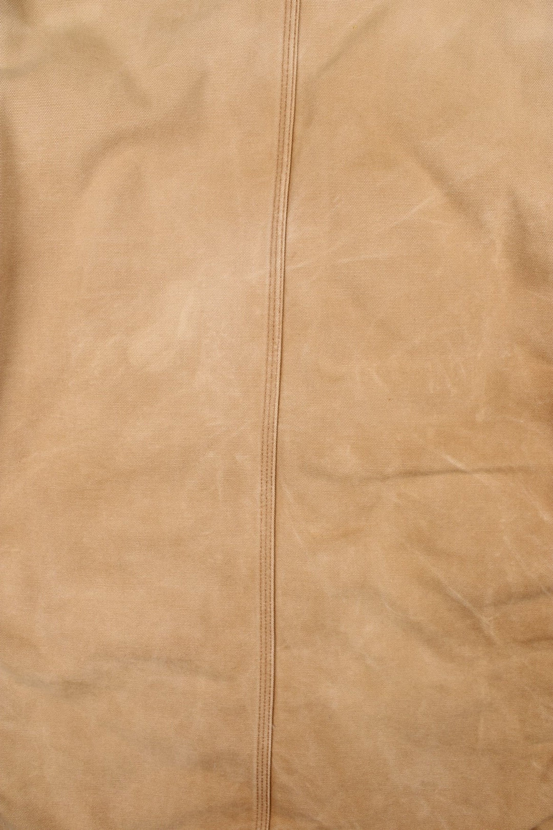 Carhartt Arctic Jacket in a tan colourway. Zips up and has multiple pockets, corduroy collar, insulated with a quilted lining, and has the logo embroidered on the front.