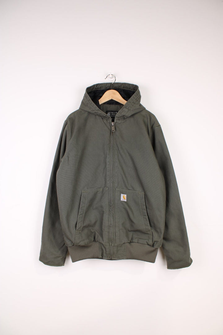 Carhartt Active Jacket in a khaki green colourway, zip up with side pockets, insulated with a quilted lining, hooded, and has the logo embroidered on the front. 