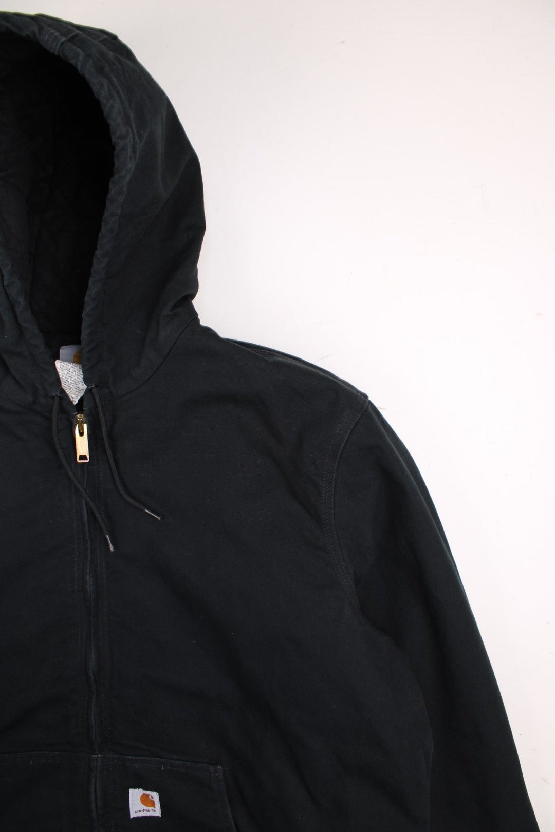 Carhartt Active Jacket in a black colourway. Zips up and has side pockets, hooded, and has the logo embroidered on the front.