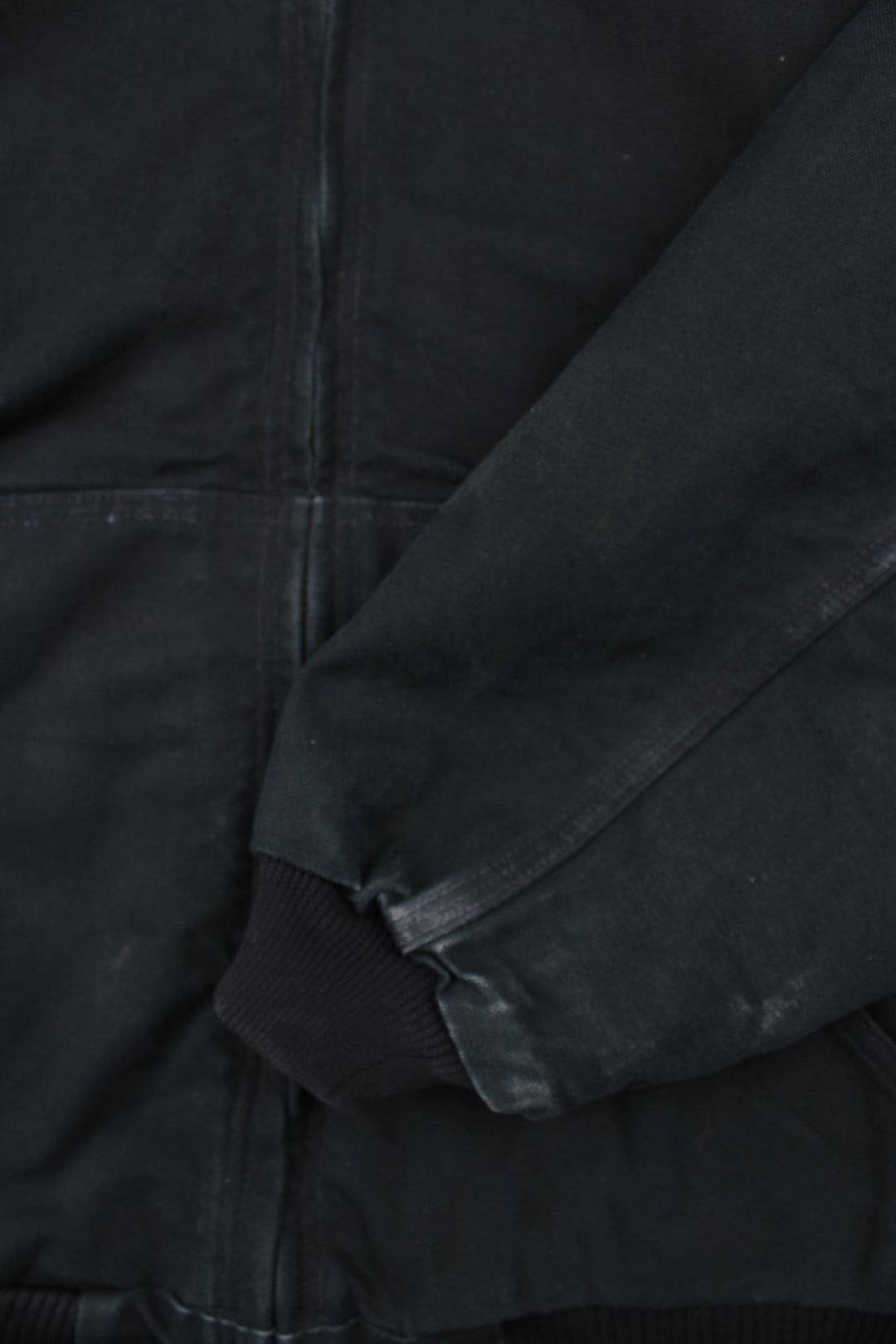 Carhartt Active Jacket in a black colourway. Zips up and has side pockets, hooded, and has the logo embroidered on the front.