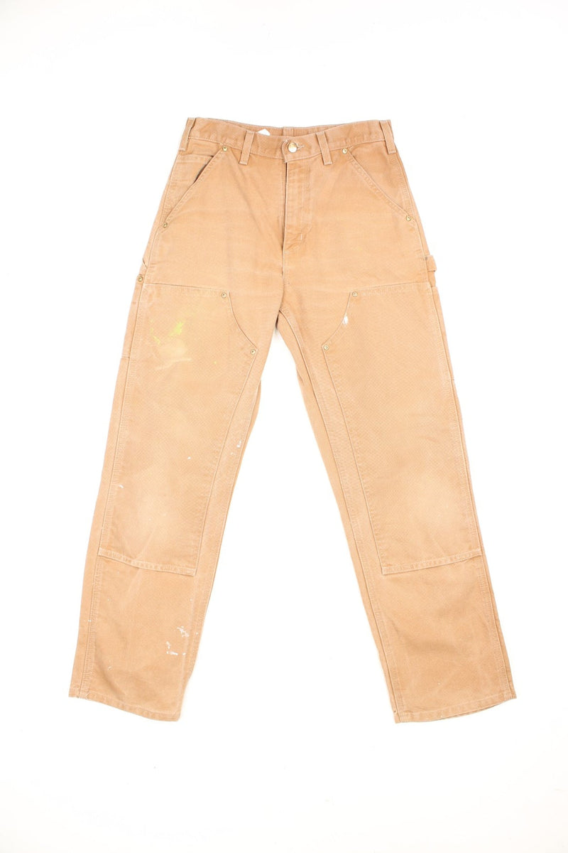 Carhartt brown dungaree fit carpenter jeans. Features double knees, multiple pockets and embroidered logo on the back