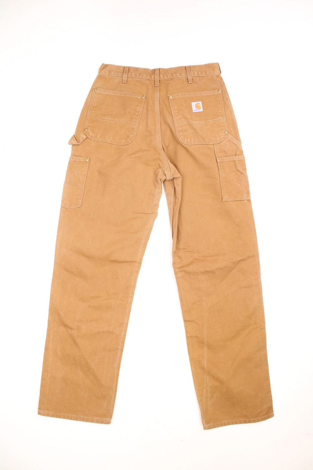 Carhartt brown loose original fit carpenter jeans. Features double knees, multiple pockets and embroidered logo on the back