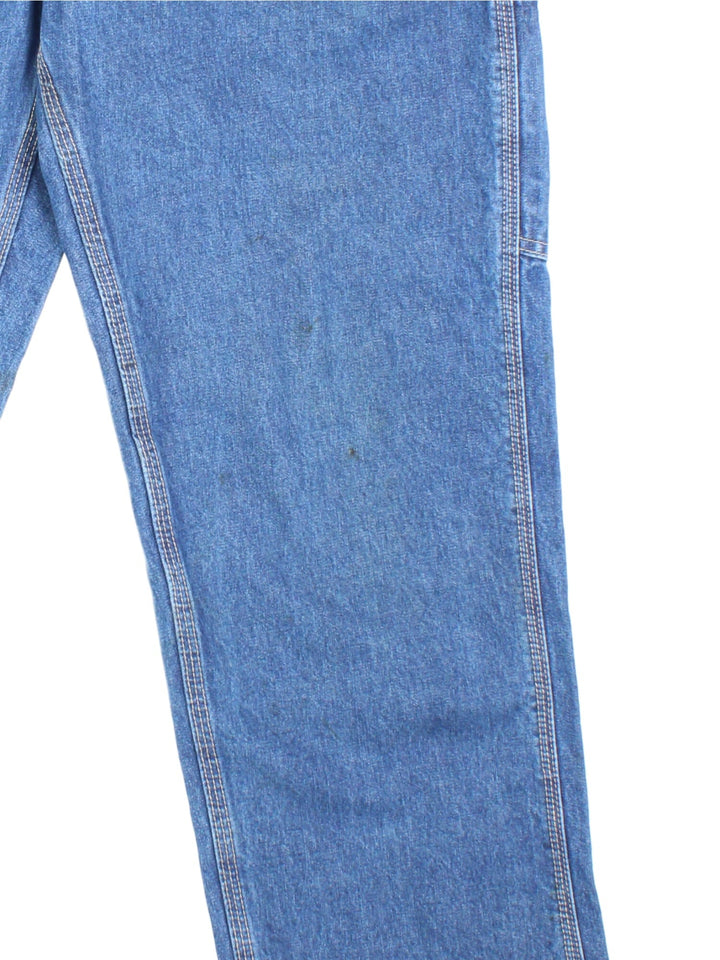 Carhartt Carpenter Jeans in a blue colourway with multiple pockets and the logo embroidered on the back.