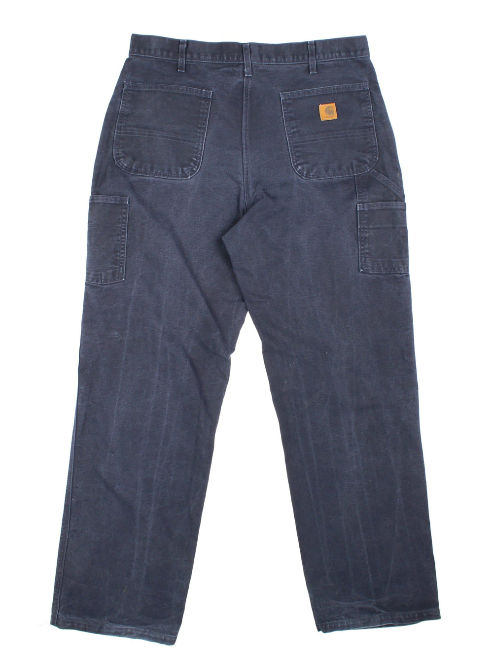 Carhartt Carpenter Jeans in a navy blue colourway with multiple pockets and the logo embroidered on the back.