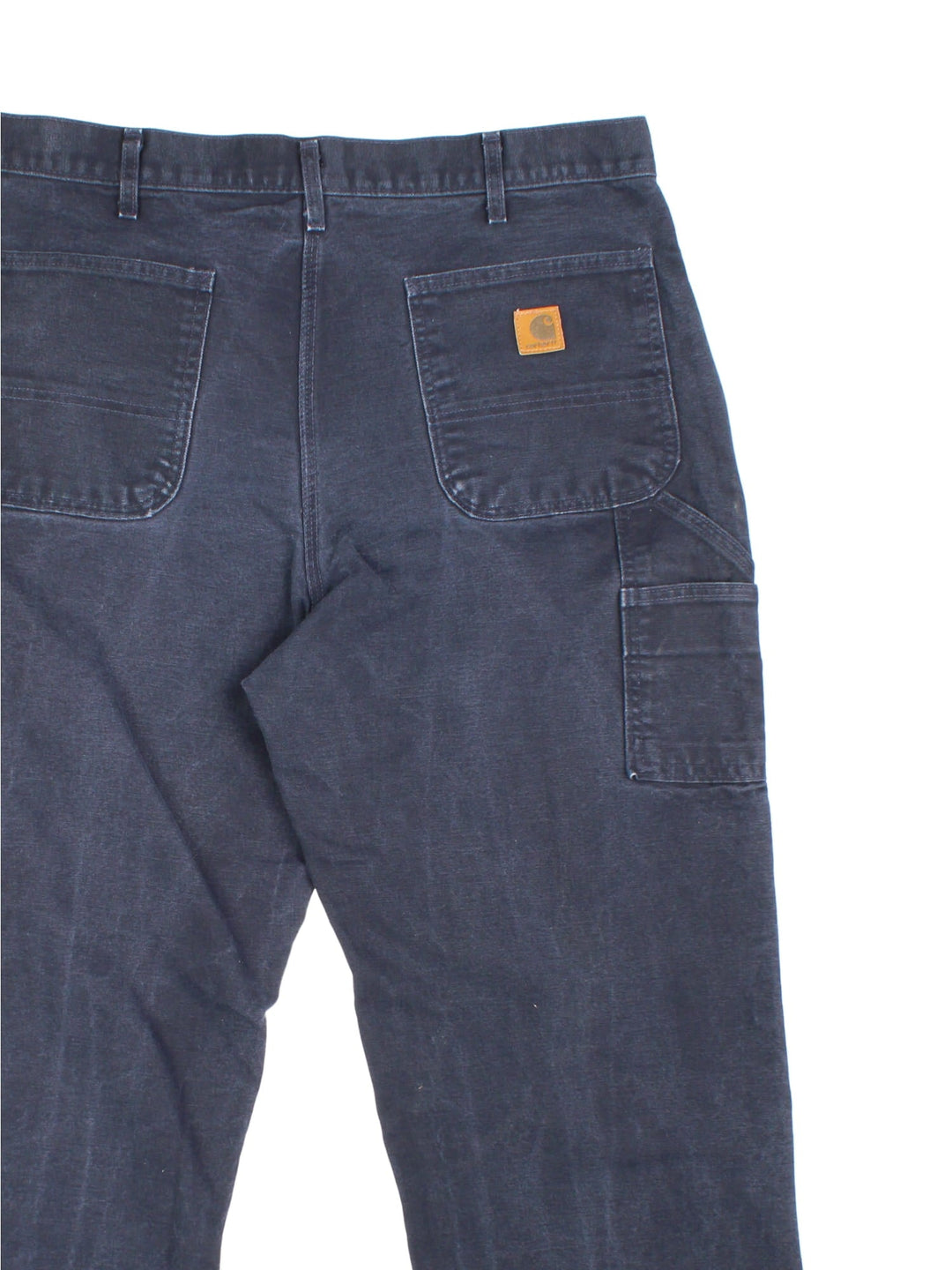 Carhartt Carpenter Jeans in a navy blue colourway with multiple pockets and the logo embroidered on the back.