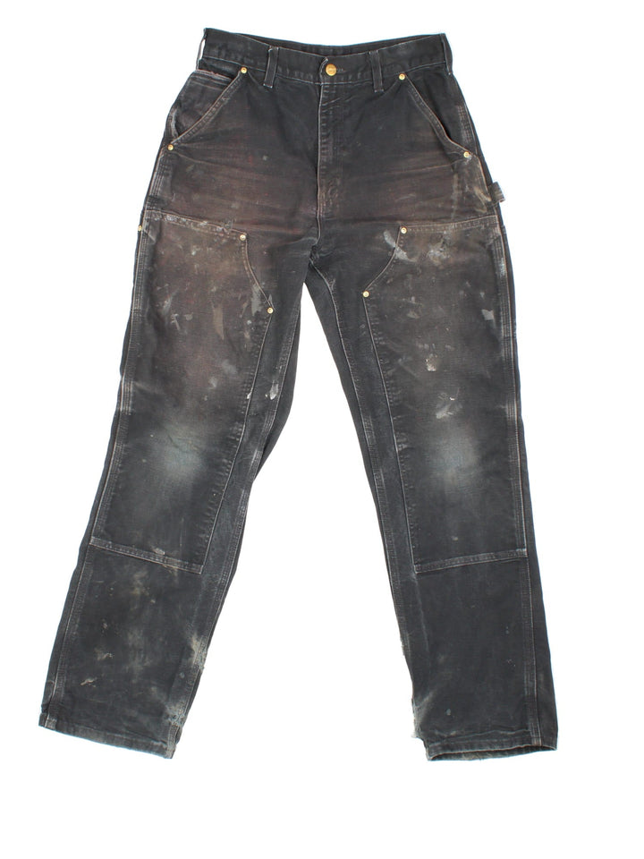 Carhartt Double Knee Jeans in a black colourway with multiple pockets and the logo embroidered on the back.