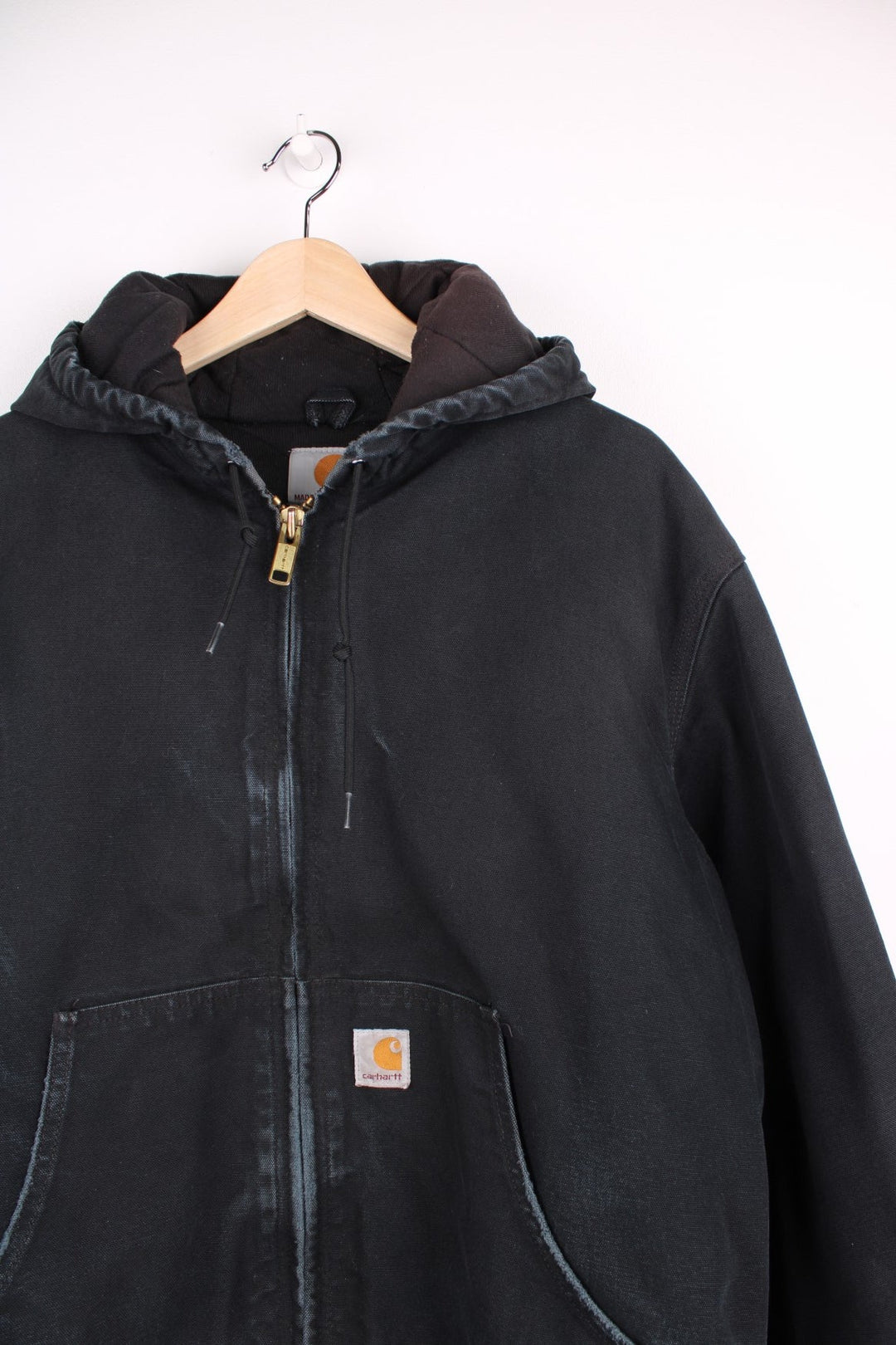 Carhartt Active Jacket in a black colourway, zips up and has side pockets, hooded and the logo embroidered on the front.