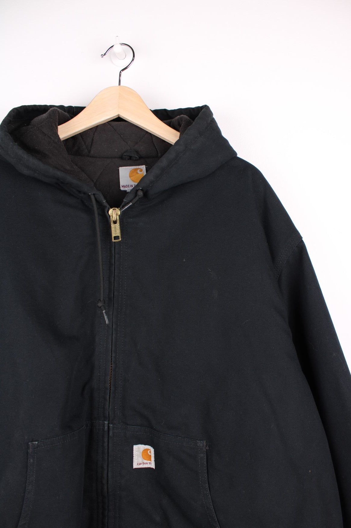 Carhartt Active Jacket in a black colourway, zips up and has side pockets, hooded and the logo embroidered on the front.